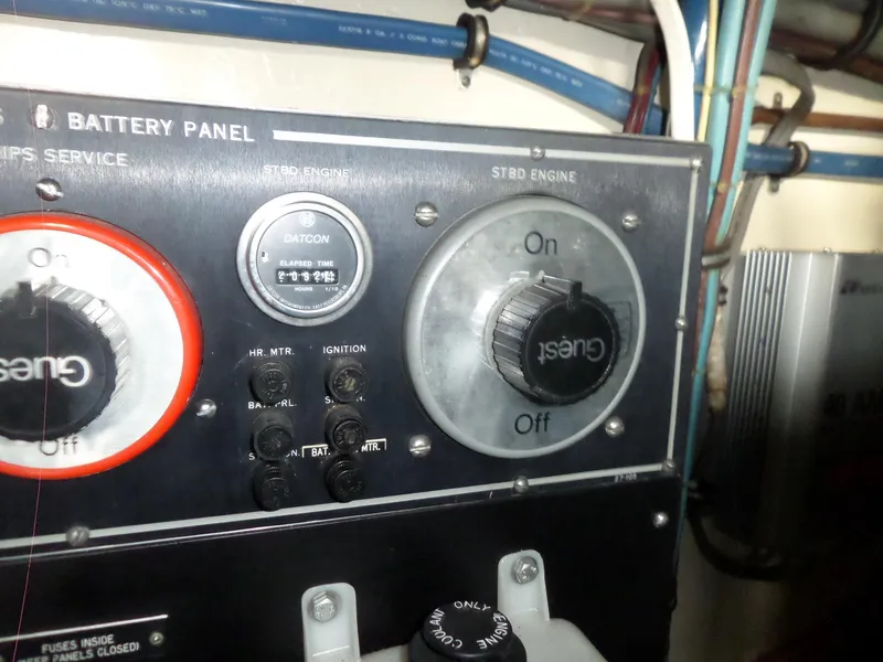 Slide: The Image of Battery panel of 1987 Hatteras 42 Convertible boat with engine controls and wiring. - 47