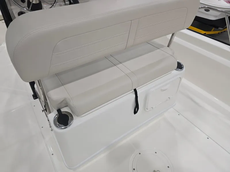 Slide: The Image of 2025 Boston Whaler 210 Montauk boat seat with storage and cup holders. - 17