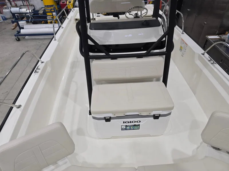 Slide: The Image of 2025 Boston Whaler 210 Montauk interior with seating and Igloo cooler. - 8