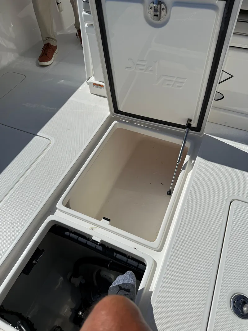 Slide: The Image of Open storage compartment on 2024 SeaVee 340Z boat deck. - 10