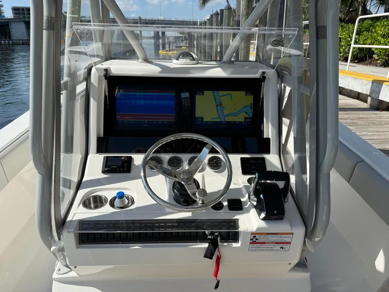 Slide: The Image of 2024 SeaVee 340Z boat console with dual screens and steering wheel. - 3