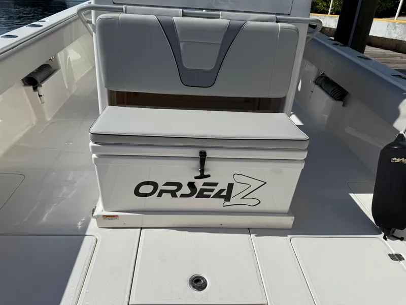 Slide: The Image of 2024 SeaVee 340Z boat interior with cushioned seating and storage. - 5