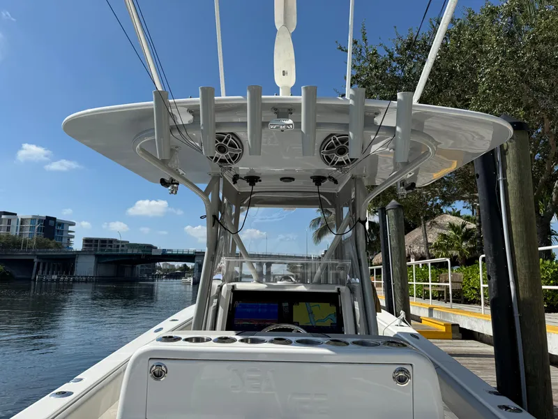 Slide: The Image of 2024 SeaVee 340Z boat docked, featuring advanced navigation and fishing equipment. - 6