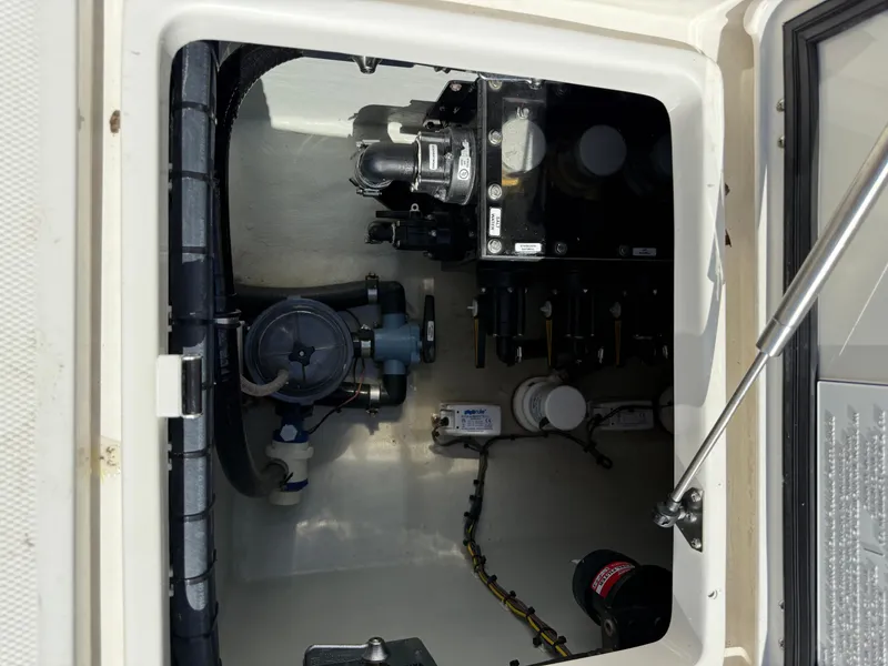 Slide: The Image of 2024 SeaVee 340Z boat compartment showcasing mechanical components and wiring. - 8