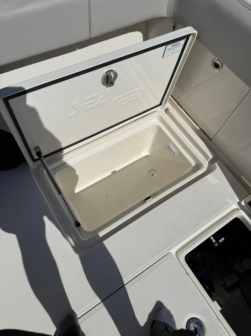 Slide: The Image of 2024 SeaVee 340Z boat storage compartment open, showcasing interior space. - 9