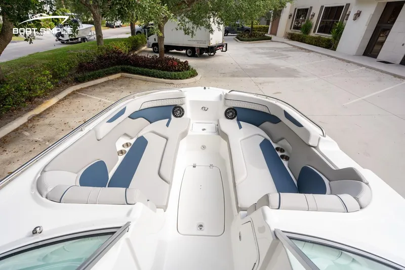 Slide: The Image of 2025 Hurricane SunDeck 2400 OB boat interior with spacious seating and modern design. - 10