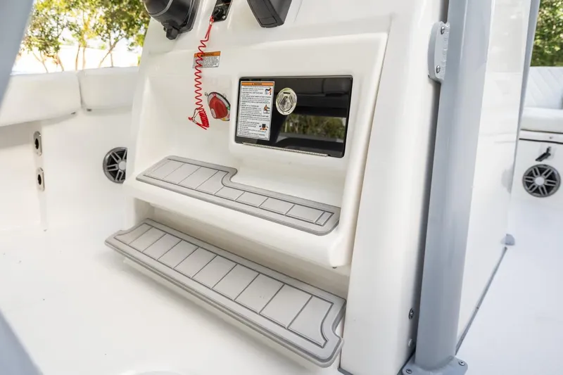 Slide: The Image of 2025 Sea Fox 228 Commander boat interior with steps and control panel. - 12