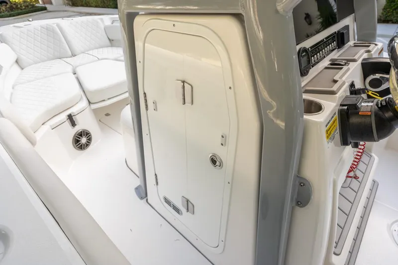 Slide: The Image of 2025 Sea Fox 228 Commander boat interior with seating and control panel. - 16