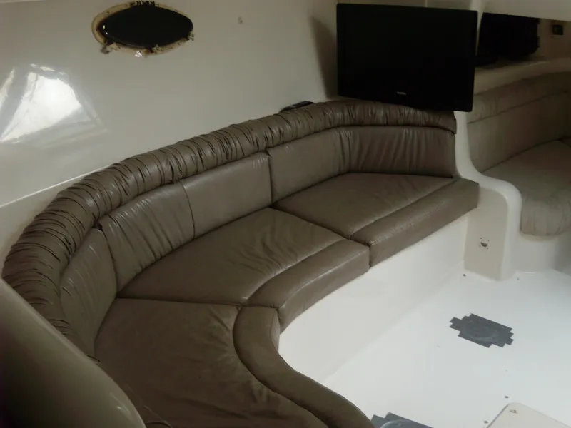 Slide: The Image of Interior of 1996 Silverton 310 Express with leather seating and mounted TV. - 13