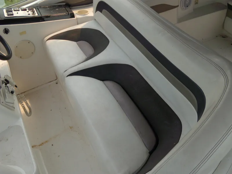 Slide: The Image of 1996 Silverton 310 Express boat interior with white and black seating. - 8