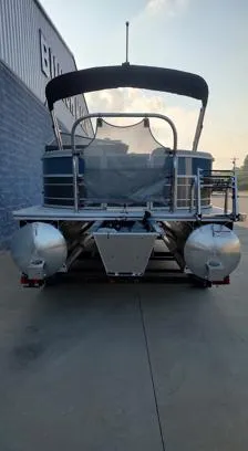 Slide: The Image of 2026 South Bay 224RS LE pontoon boat, rear view, parked outdoors. - 7