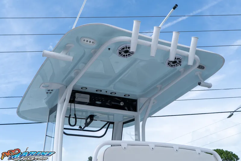 Slide: The Image of 2026 Sea Hunt Ultra 275 SE boat T-top with rod holders and speakers. - 18