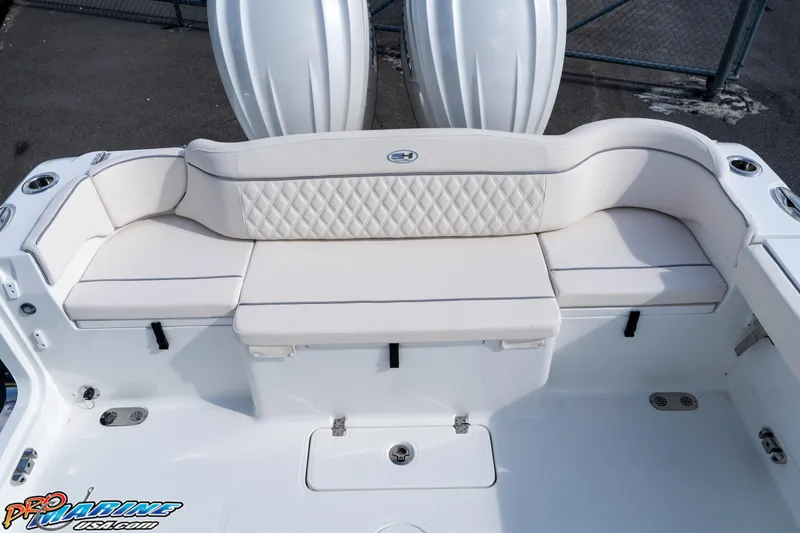 Slide: The Image of 2026 Sea Hunt Ultra 275 SE boat with white cushioned seating and diamond pattern design. - 25