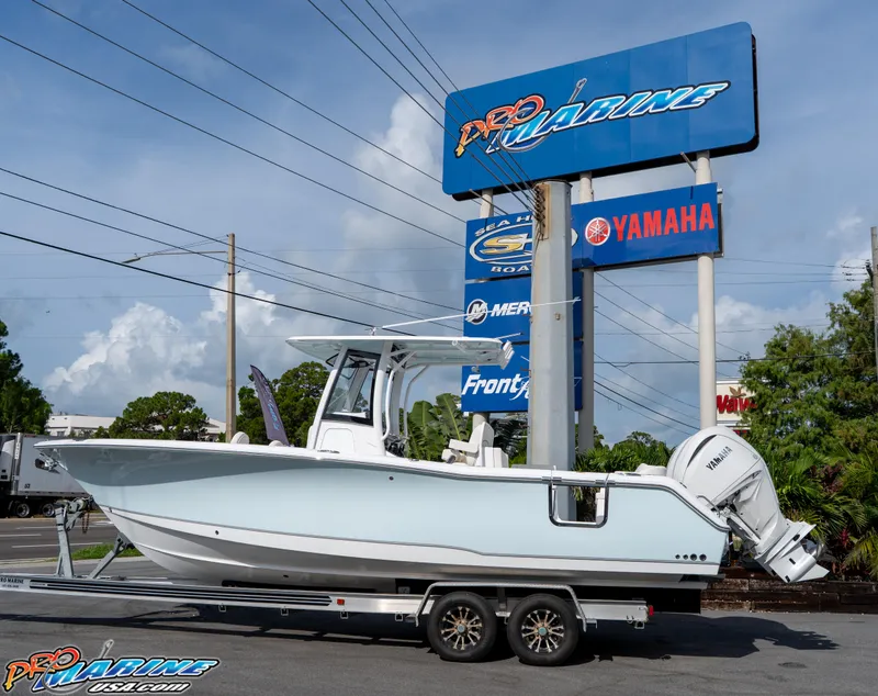 Slide: The Image of 2026 Sea Hunt Ultra 275 SE boat on trailer at Pro Marine dealership. - 3