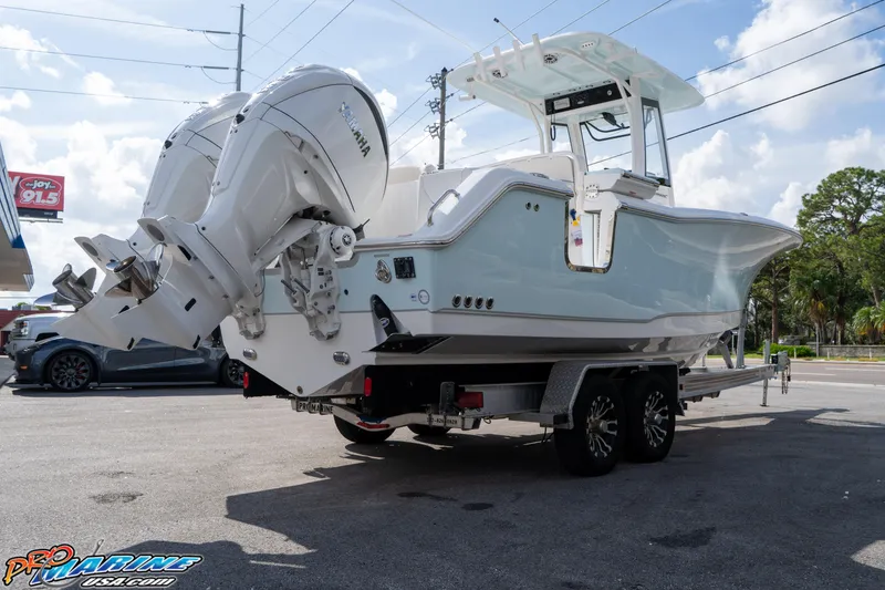 Slide: The Image of 2026 Sea Hunt Ultra 275 SE boat on trailer, featuring dual Yamaha engines. - 4