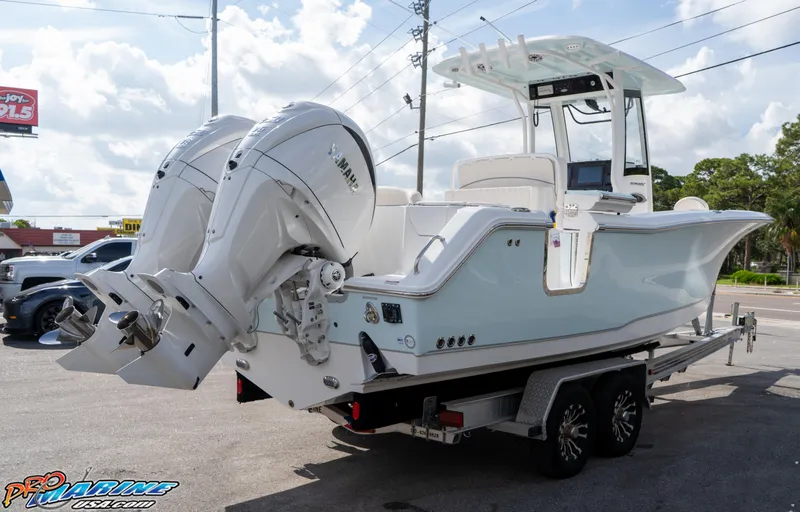 Slide: The Image of 2026 Sea Hunt Ultra 275 SE boat on trailer with dual Yamaha engines. - 5