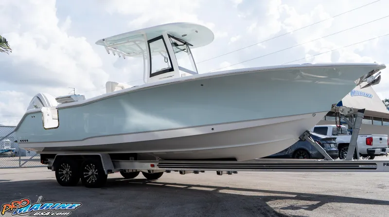 Slide: The Image of 2026 Sea Hunt Ultra 275 SE boat on trailer, displayed outdoors. - 6
