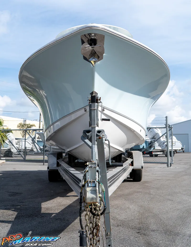 Slide: The Image of 2026 Sea Hunt Ultra 275 SE boat on trailer, parked outdoors. - 7