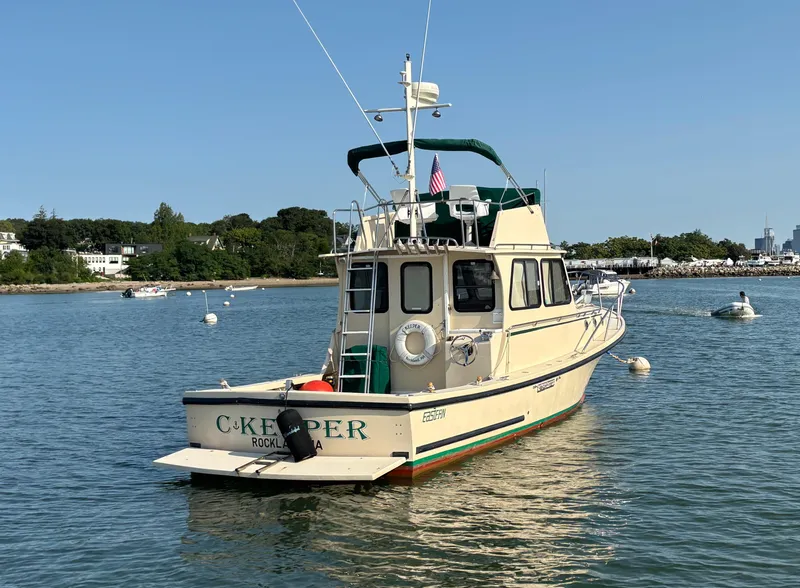 Slide: The Image of Eastern Casco Bay 31 boat from 2000 anchored in a scenic harbor. - 1