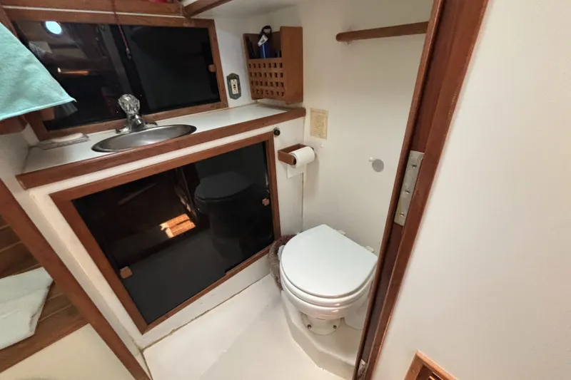 Slide: The Image of Bathroom interior of 2000 Eastern Casco Bay 31 boat with sink and toilet. - 15