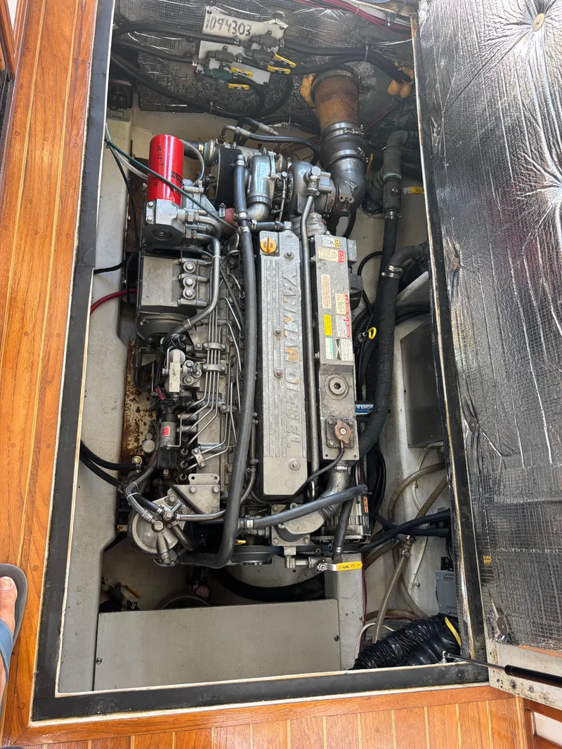 Slide: The Image of Engine compartment of a 2000 Eastern Casco Bay 31 boat, showcasing detailed machinery. - 17