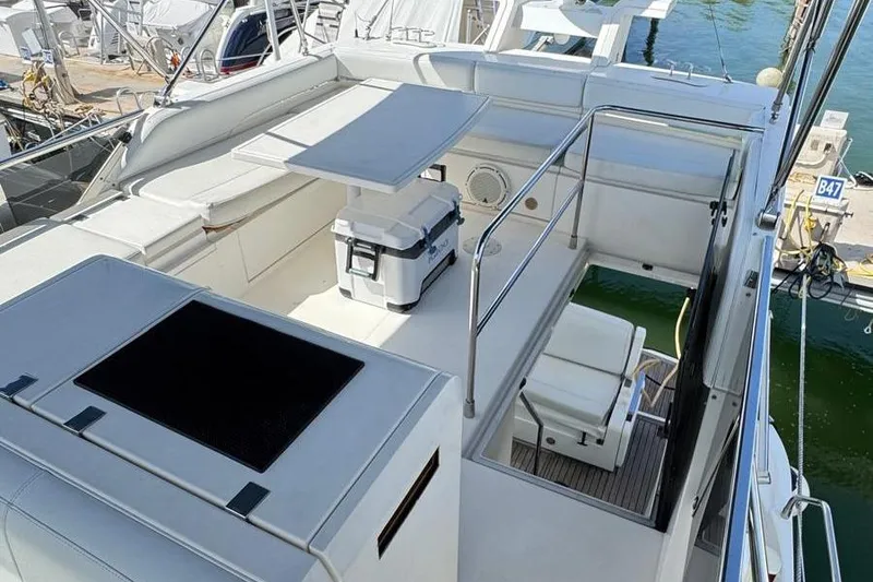 Slide: The Image of Flybridge deck with seating and table. - 22