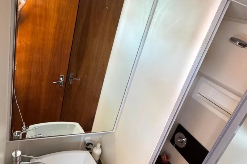 Slide: The Image of Bathroom interior of 2013 Fairline Squadron 42 yacht, featuring sink and mirror. - 28