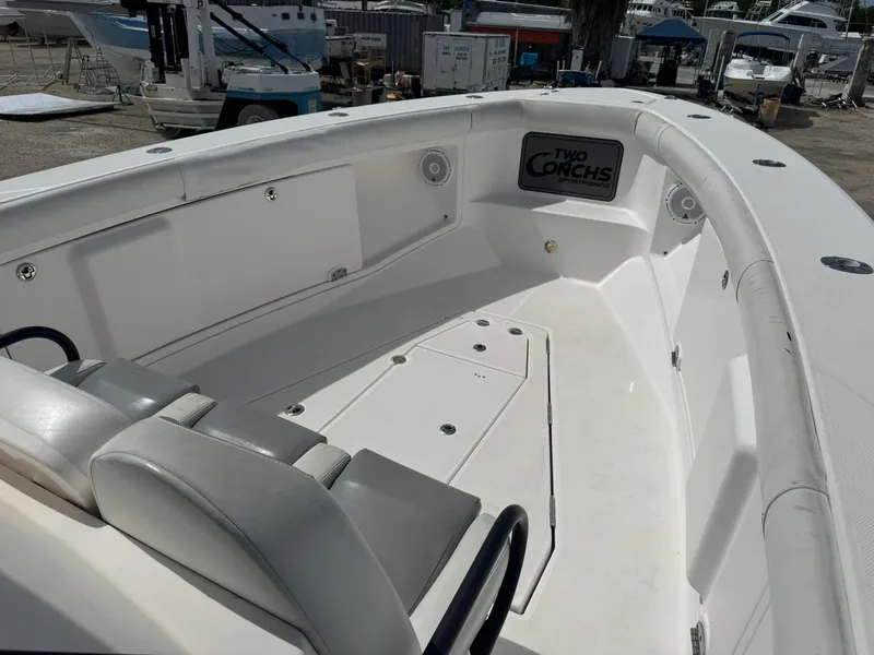Slide: The Image of 2016 Everglades 355 Tournament boat interior with seating and storage. - 11