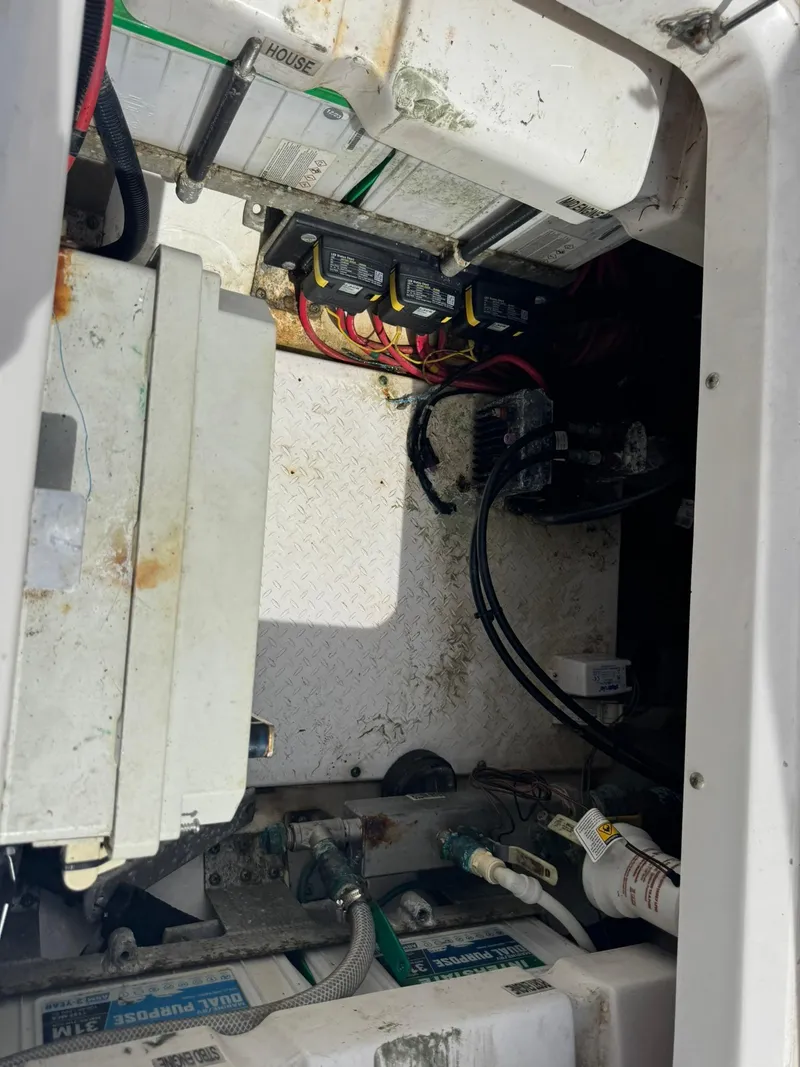 Slide: The Image of Electrical compartment of a 2016 Everglades 355 Tournament boat, showing wiring and components. - 16