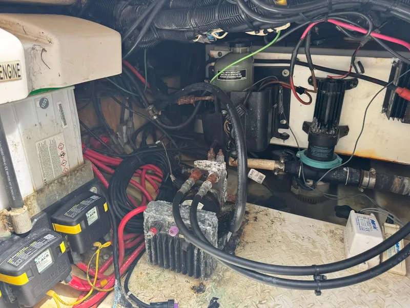 Slide: The Image of Engine compartment of a 2016 Everglades 355 Tournament boat, showing wiring and components. - 17