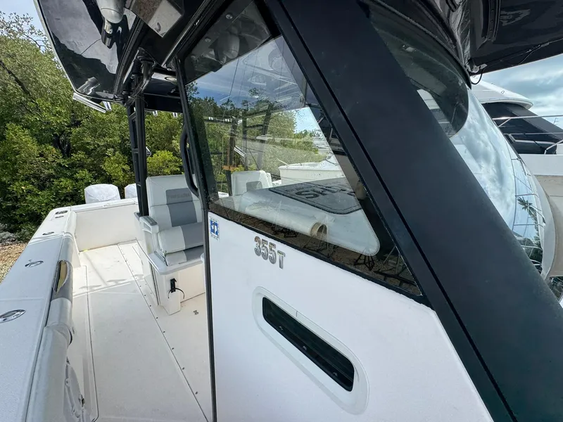 Slide: The Image of 2016 Everglades 355 Tournament boat, side view with seating and console details. - 23