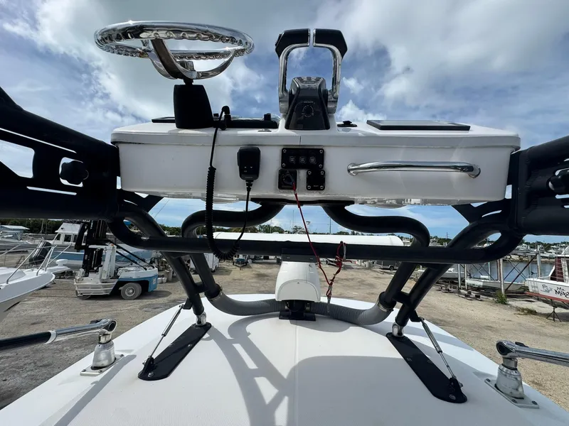 Slide: The Image of 2016 Everglades 355 Tournament boat helm station with steering wheel and controls. - 27