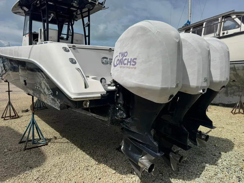 Slide: The Image of 2016 Everglades 355 Tournament boat with triple outboard engines on stands. - 5