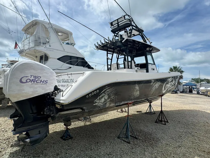 Slide: The Image of 2016 Everglades 355 Tournament boat on stands, featuring "Two Conchs" branding. - 6