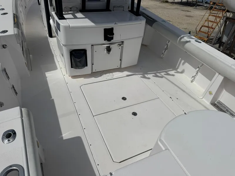 Slide: The Image of 2016 Everglades 355 Tournament boat deck with storage compartments and seating. - 7