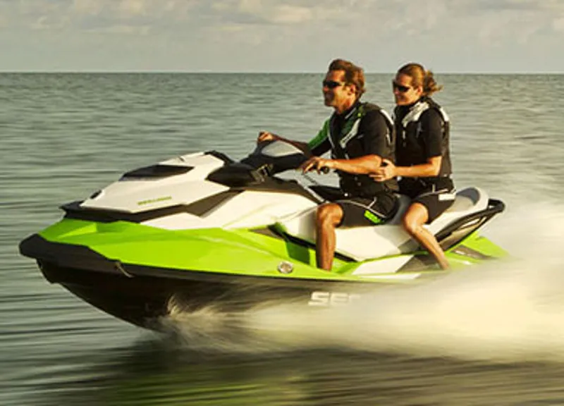 Slide: The Image of Manufacturer Provided Image: 2013 Sea-Doo GTI SE 130 jet ski with two riders on the water. - 3