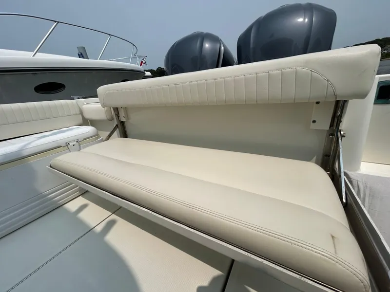 Slide: The Image of 2011 Hydra-Sports 3000 VX boat with white cushioned seating and dual outboard motors. - 12