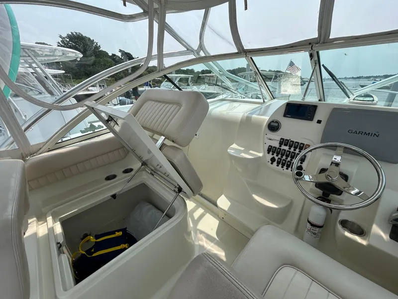 Slide: The Image of 2011 Hydra-Sports 3000 VX boat interior with Garmin navigation, steering wheel, and storage compartment. - 13