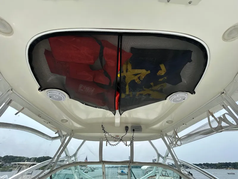 Slide: The Image of 2011 Hydra-Sports 3000 VX boat docked with dual engines, clear canopy, and scenic background. - 20