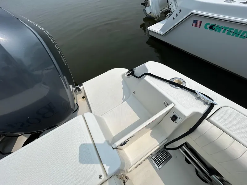 Slide: The Image of 2011 Hydra-Sports 3000 VX boat docked, showcasing sleek design and helm station. - 22