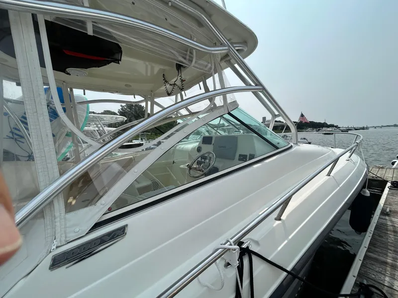 Slide: The Image of 2011 Hydra-Sports 3000 VX with Yamaha outboard engines on a calm lake. - 23