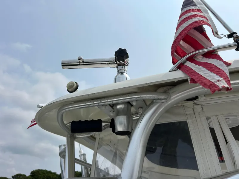 Slide: The Image of 2011 Hydra-Sports 3000 VX boat with American flag and stainless steel rod holder. - 33