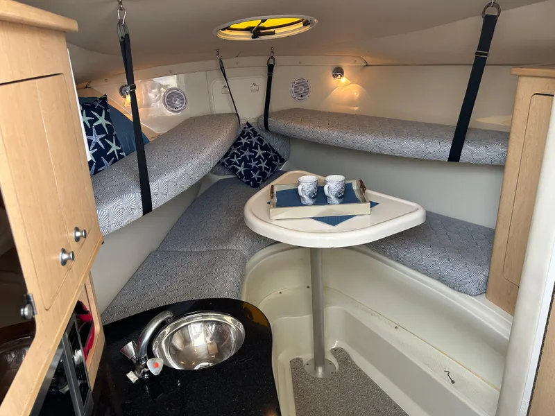 Slide: The Image of Cabinet with dishes and glasses on a 2011 Hydra-Sports 3000 VX boat. - 40