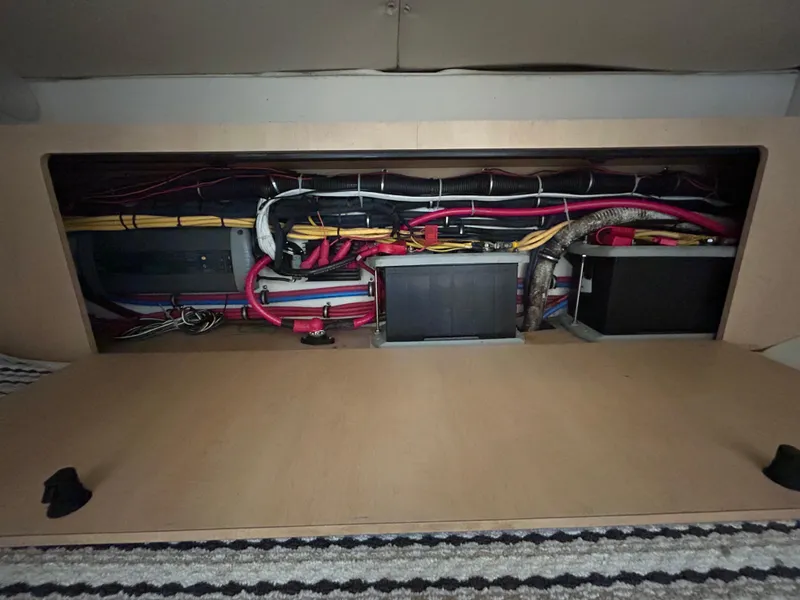 Slide: The Image of 2011 Hydra-Sports 3000 VX boat battery compartment with cables and equipment. - 44