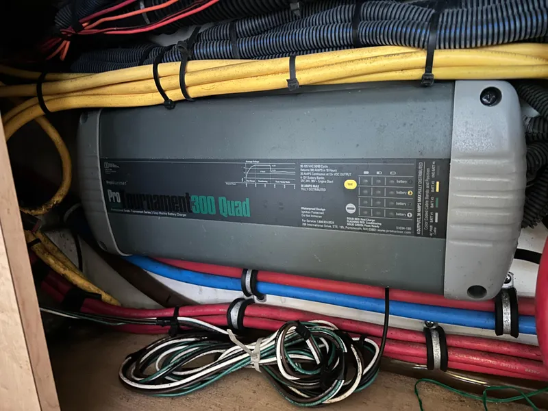 Slide: The Image of Battery compartment of a 2011 Hydra-Sports 3000 VX boat, showing wiring and connections. - 46