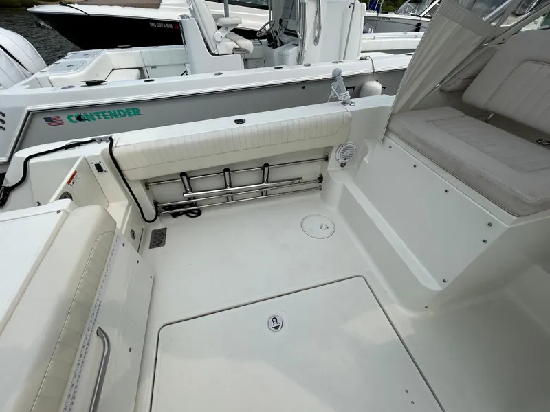 Slide: The Image of 2011 Hydra-Sports 3000 VX boat interior seating with white cushioned upholstery. - 49