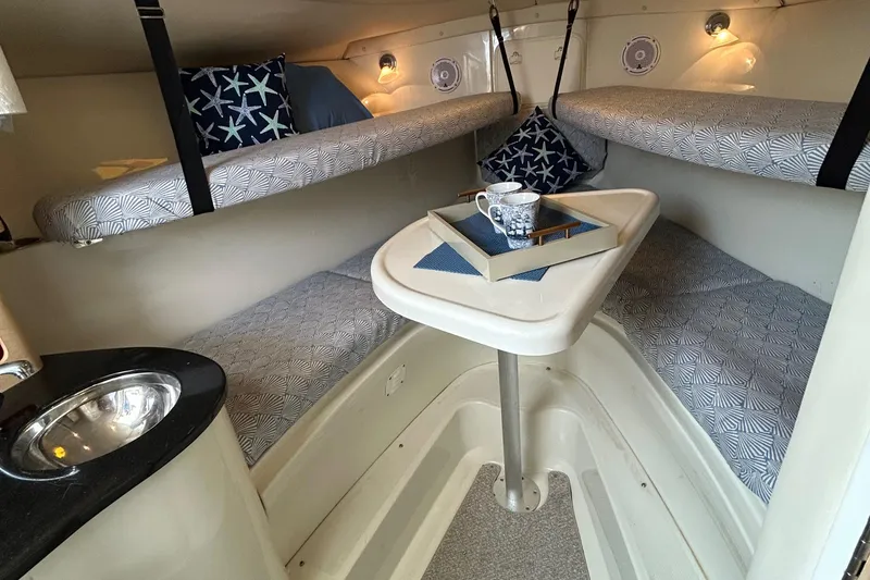 Slide: The Image of 2011 Hydra-Sports 3000 VX boat with American flag, clear skies, and sleek design. - 63