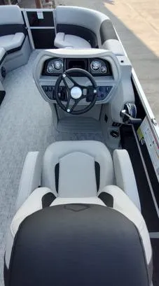 Slide: The Image of 2026 South Bay 224UL LE boat interior with steering wheel and seating. - 5