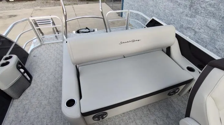 Slide: The Image of 2026 South Bay 224UL LE pontoon boat interior with cushioned seating and cup holders. - 6