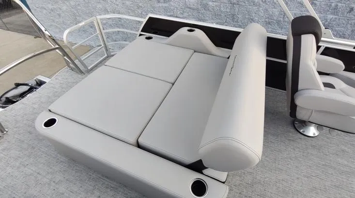Slide: The Image of 2026 South Bay 224UL LE boat interior with gray seating and cup holders. - 7